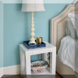 F35. One of three white lacquered nightstands. 25”h x 21”w x 16”d 